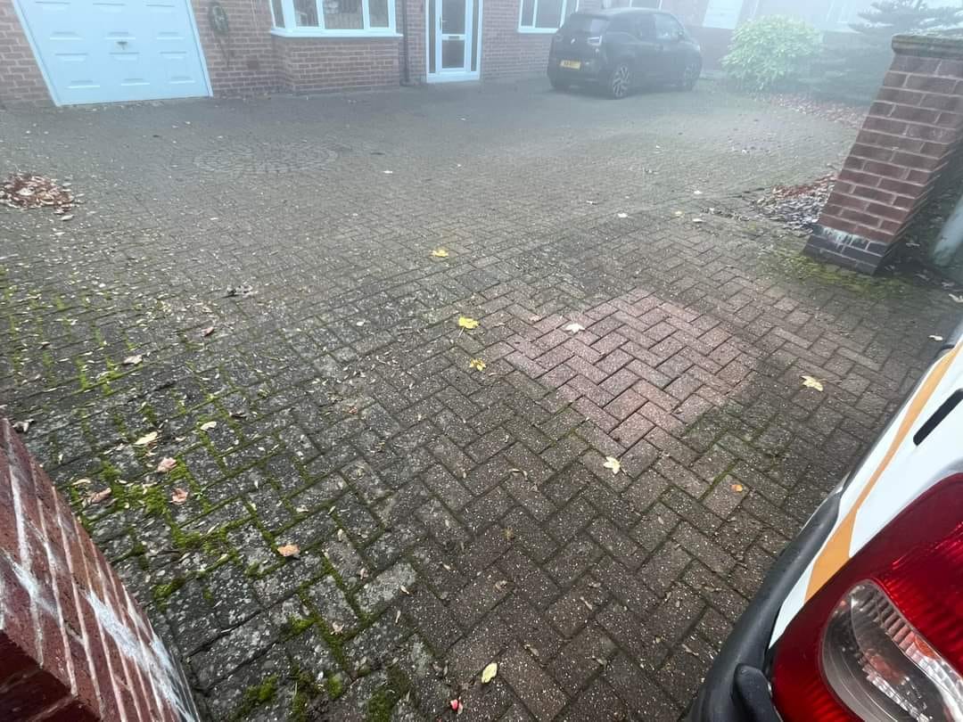 Driveway before pressure washing
